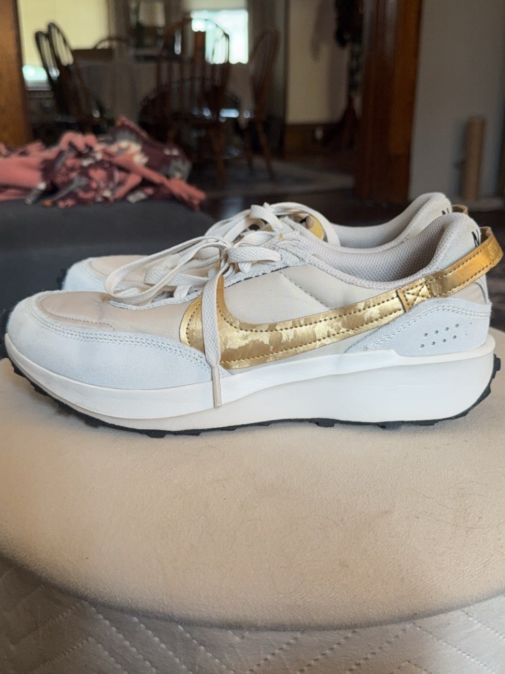 Nike Women's White Sneakers with Metallic Gold Swoosh